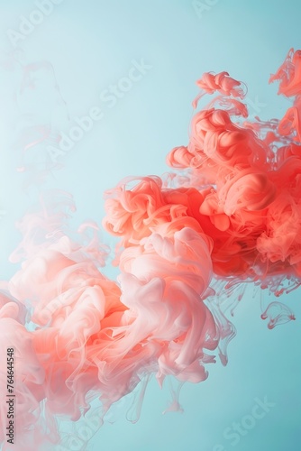 Vivid Pink Ink Swirling Gracefully in Tranquil Blue Water Capturing the Dynamics of Fluid Motion