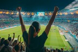Soccer fans cheer their team at a crowded stadium at night celebrating a victory. Concept Sports, Soccer, Fans, Stadium, Night
