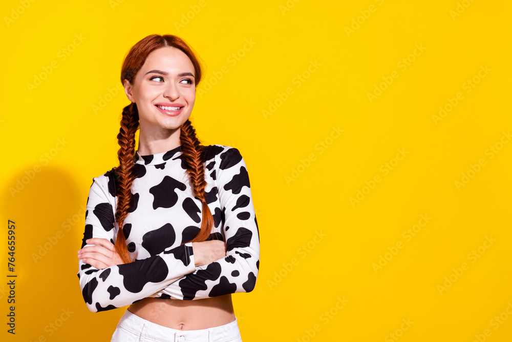 Photo of confident thoughtful lady dressed cowskin print top looking empty space isolated yellow color background - obrazy, fototapety, plakaty 