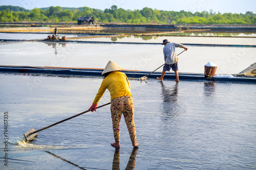 Farmers working on salt fields in Can Gio district of Ho Chi Minh City, Vietnam.