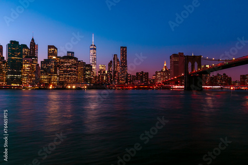  Brooklyn Bridge with lower Manhattan skyline in New York City at night  USA. Long exposure at night