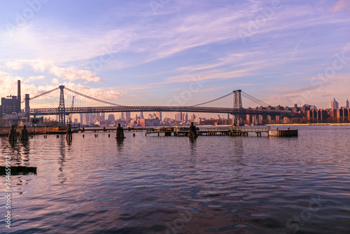  Brooklyn Bridge with lower Manhattan skyline in New York City at night, USA. Long exposure at night © Birol