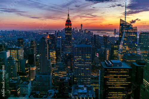 New York Manhattan view from One World Trade Center. sunset view with financial buildings city light. Empire State building on sunset  photo