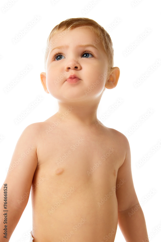 Portrait of beautiful little baby boy, child standing with curious look isolated over white studio background. Concept of childhood and family, care, parenthood, infancy and heath Portrait of beautiful little baby boy, child standing with curious look isolated over white studio background. Concept of childhood and family, care, parenthood, infancy and heath