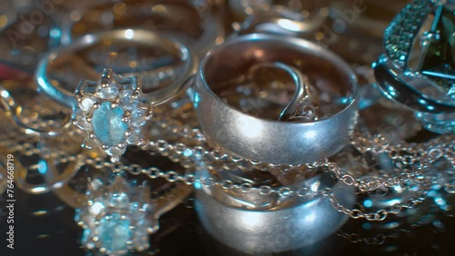 Beautiful shiny, sparkling golden jewelry with glare in gems. Macro. Closeup. Shallow depth of field