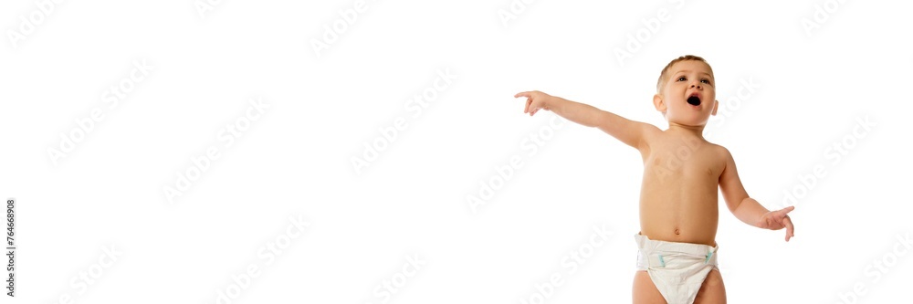Smart, adorable child, baby boy in diaper standing with active expression isolated on white background. Concept of childhood and family, care, parenthood, infancy and heath. Banner. Empty space for ad Smart, adorable child, baby boy in diaper standing with active expression isolated on white background. Concept of childhood and family, care, parenthood, infancy and heath. Banner. Empty space for ad
