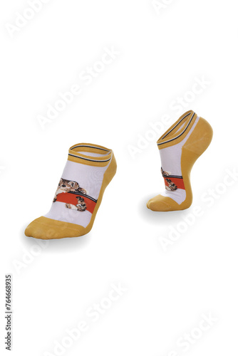 Close-up shot of a woman's white and yellow printed socks. A pair of short nylon socks with cat-print is isolated on a white background. Side view. photo