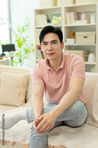 Photo of young Asian man at home Free Download Photo of young Asian man at home - GFXLoad