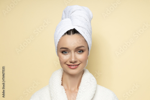 Attractive young girl with a towel on her head