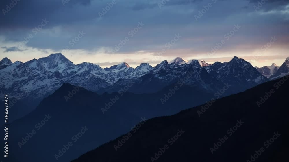 Beautiful sunrise in the high altitude mountain range of Tibet and Nepal. Himalayan sunrise with clouds. snowy ice capped summits Beautiful sunrise in the high altitude mountain range of Tibet and Nepal. Himalayan sunrise with clouds. snowy ice capped summits