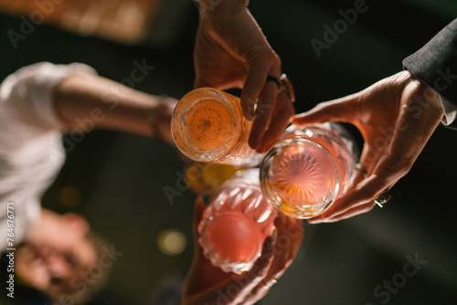 Canvas Print Group of friends celebrate event with alcoholic drinks in pub