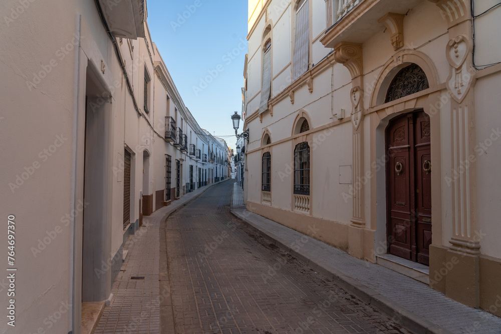 Streets of the beautiful village of Olivenza with its white typical houses at sunset. Badajoz, Extremadura, Spain