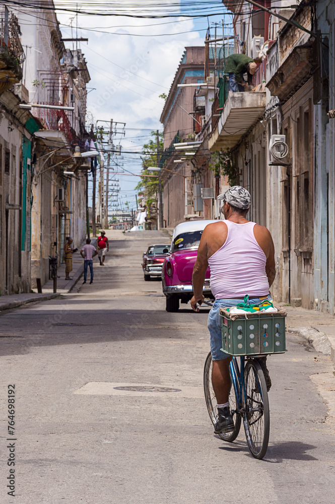 Cuban riding a bike in the old Havana - Cuba
