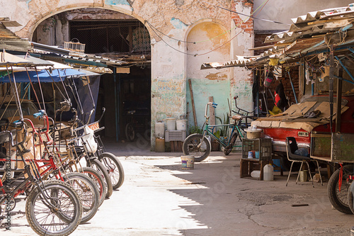 Fototapeta Naklejka Na Ścianę i Meble -  Local parking for the popular Bici-Taxi in Old Havana. These are the means of transportation most used by Cubans to move within the city.