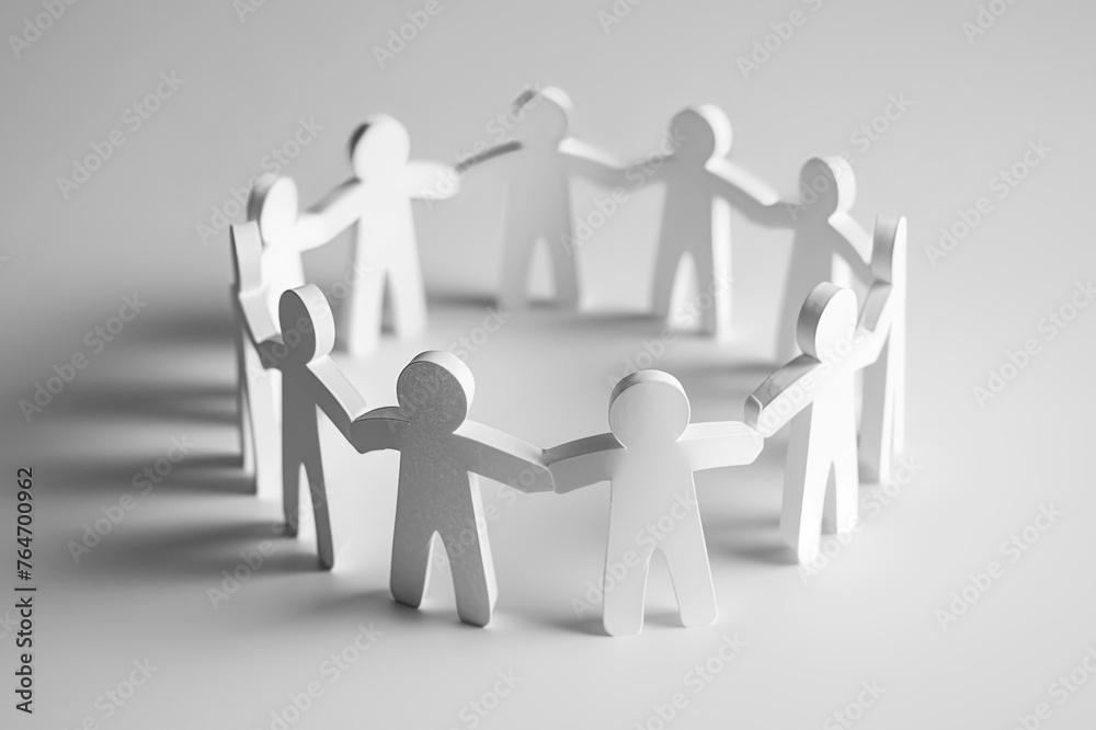 A team of people holding hands