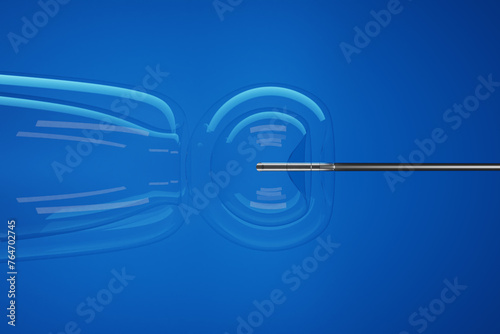 Injection of stem cell into a transparent embryo by a silver sharp needle in blue background. Illustration of the concept of targeted embryonic stem (ES) cell microinjection photo