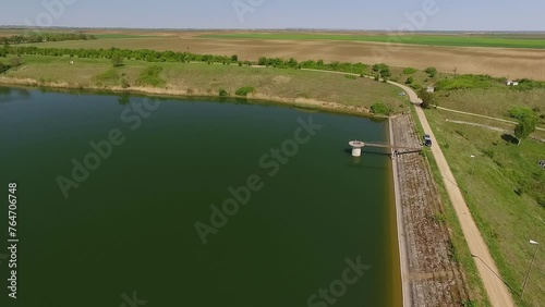 Aerial footage of Lake Medjes and a pier building connected to the shore photo