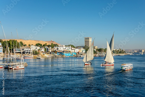 Feluccas (traditional egyptian sailing boats) on the Nile river in Aswan, Egypt