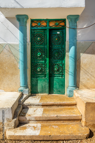 Colorful blue and green nubian door in Elephantine island, Aswan, Egypt