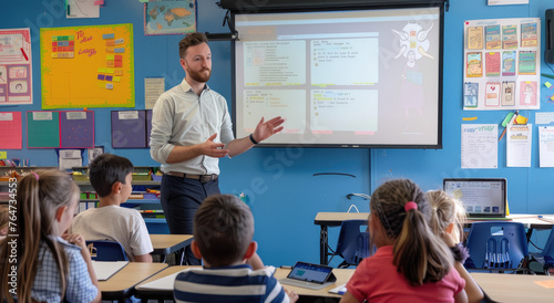 A teacher is standing in front of the whiteboard, teaching students sitting at desks. The classroom has blue walls and several posters on them