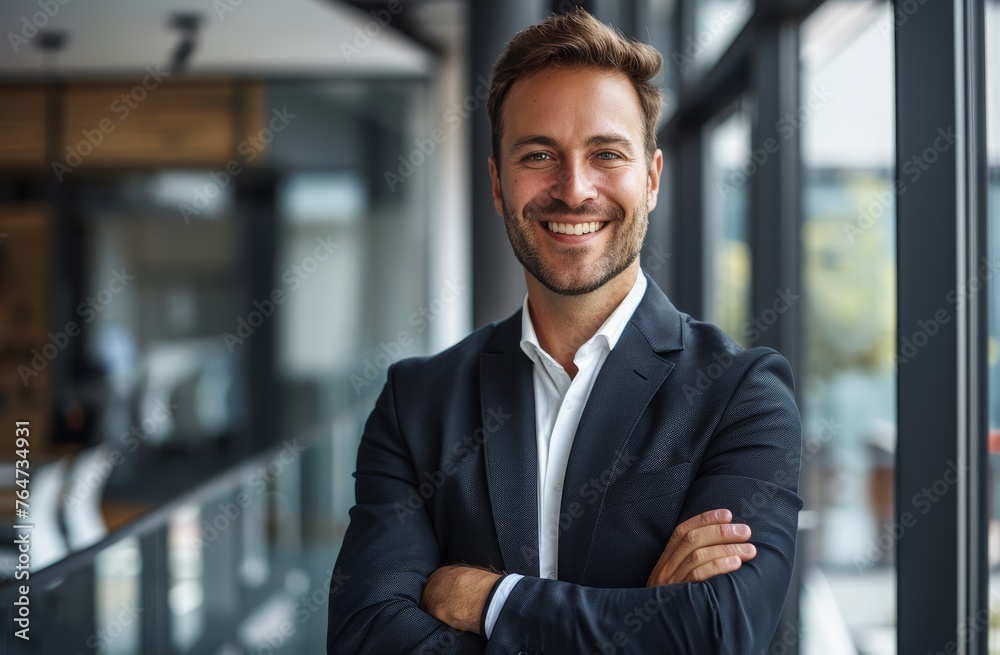 Smiling businessman in the office. Portrait of a happy business owner or entrepreneur in a suit. Smiling businessman in the office. Portrait of a happy business owner or entrepreneur in a suit.