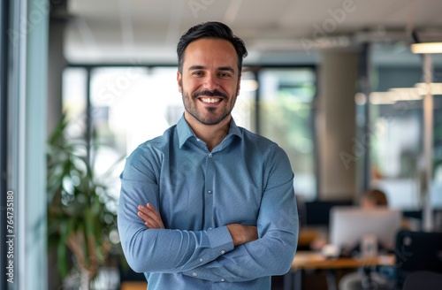 Smiling businessman in the office. Portrait of a happy business owner or entrepreneur.