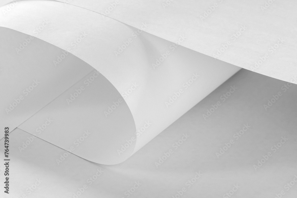 Large long sheets of white paper in black and white as a background. Large long sheets of white paper in black and white as a background.