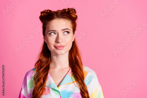 Photo of dreamy adorable girl with red tails dressed colorful blouse look at proposition empty space isolated on pink color background