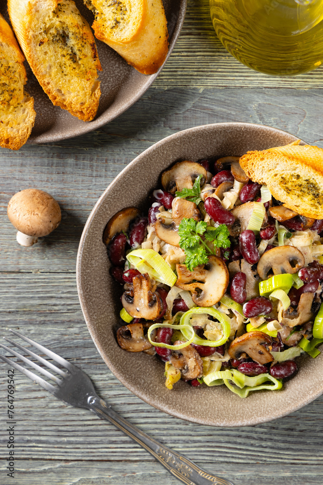 Spring salad with red beans and mushrooms. Served with croutons and garlic butter. Spring salad with red beans and mushrooms. Served with croutons and garlic butter.