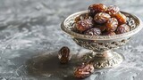 Silver bowl filled with dates as traditional Ramadan treat 