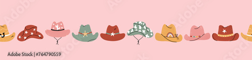 Lovely illustrated cowboy hats with different ornaments, cactus, horseshoe, stars. Vector hand drawn illustration, seamless pattern, great for textiles, wallpapers, wrapping. © TALVA