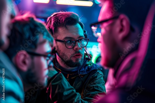 Esports coach strategizing with team members during a pause in the competition