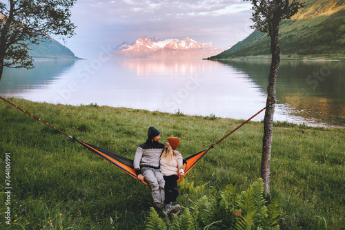 Romantic couple relaxing in hammock outdoor man and woman traveling together in Norway family lifestyle camping summer vacations boyfriend and girlfriend romantic holidays, love Valentines day