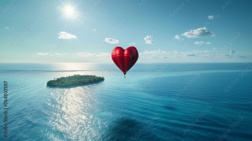 Fototapeta premium A heart-shaped balloon is seen flying gracefully over a small island in the distance, creating a striking contrast against the clear blue sky.