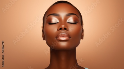 A woman with dark skin and a light brown background