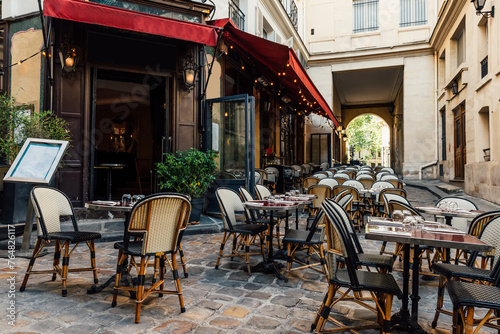 Cozy street near Boulevard San-German with tables of cafe  in Paris, France. Cityscape of Paris. Architecture and landmarks of Paris © Ekaterina Belova