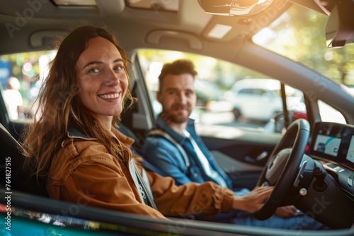 Smiling couple seated in a car with focus on the woman, hints at travel and partnership in a modern vehicle