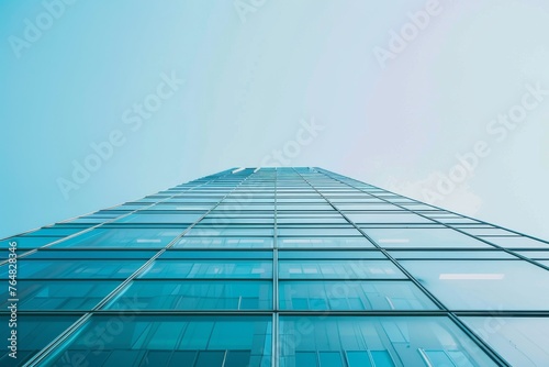 A stunning view of a glass-clad building reflecting the sky  showcasing modern design and environmental integration