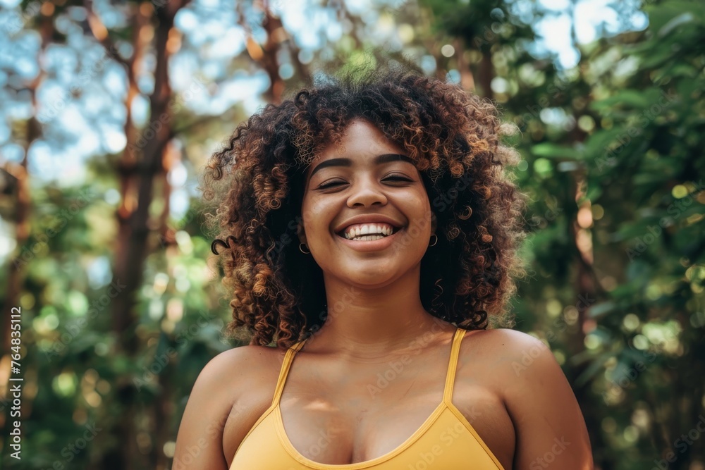 Warm, energetic portrait of a young woman laughing amidst lush greenery in a bright, summery scene Warm, energetic portrait of a young woman laughing amidst lush greenery in a bright, summery scene