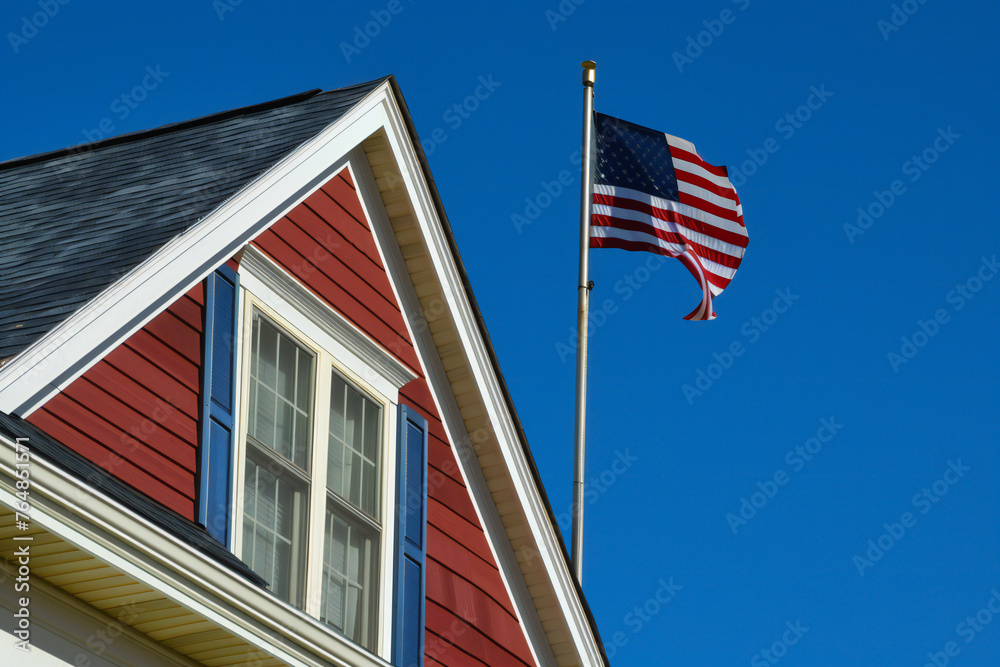 Fototapeta premium American flag on corner of residential house symbol 