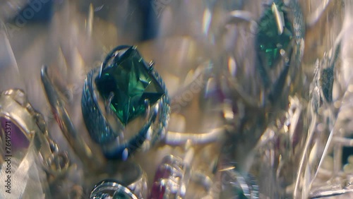 Beautiful shiny, sparkling golden jewelry with glare in gems. Macro. Closeup. Shallow depth of field photo