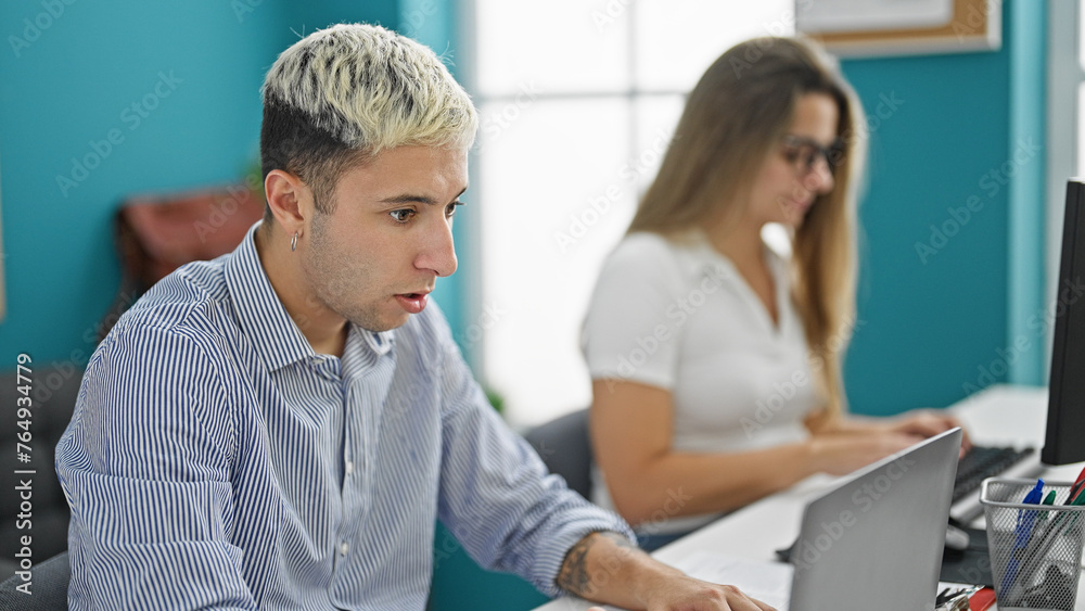 Two workers man and woman working together at the office Two workers man and woman working together at the office