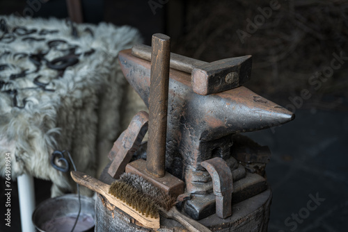 Anvil with hammers in a forge.