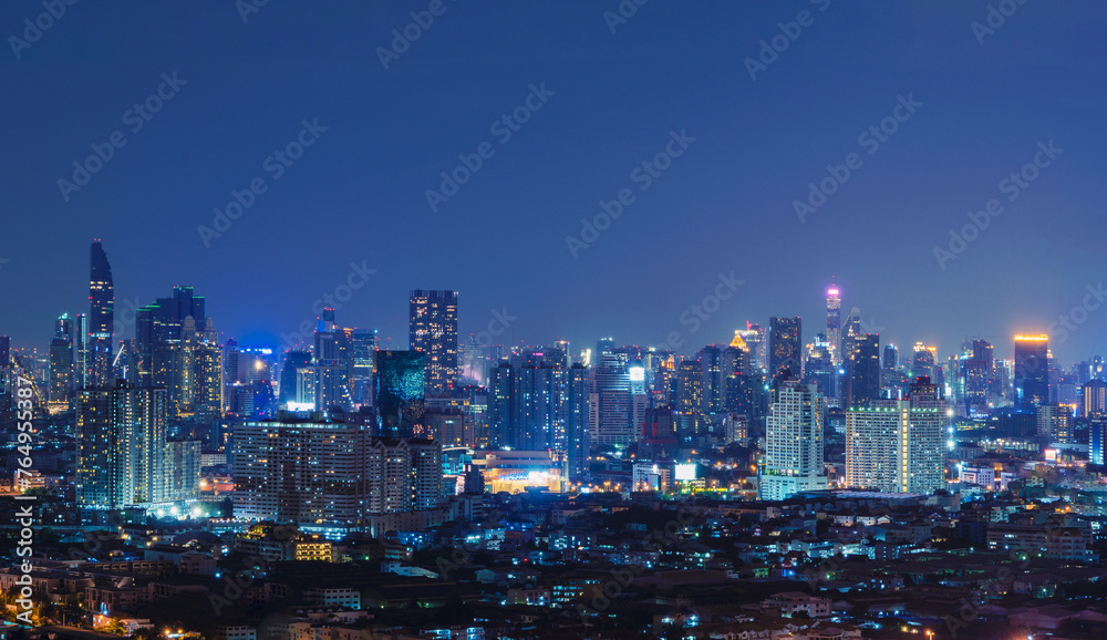 Smart city. Financial district and skyscraper buildings. Bangkok downtown area at night, Thailand.