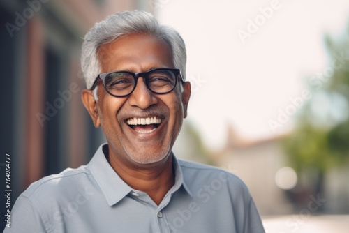 Portrait of smiling senior man of Indian ethnicity 
