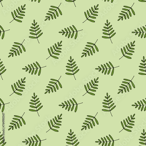 Seamless pattern in wondrous green branches on light green background. Vector image.