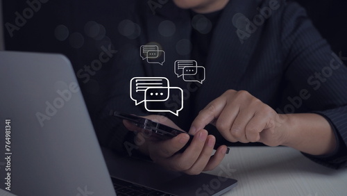 Person typing on mobile smart phone chatting conversation in chat box icon pop up for social media marketing technology. Live Chat Chatting on application.Sosial media chat concept.