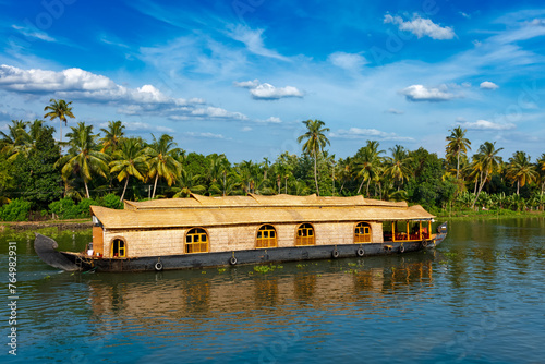 Kerala India tourism travel background - Houseboat on Kerala backwaters in Kerala state of India