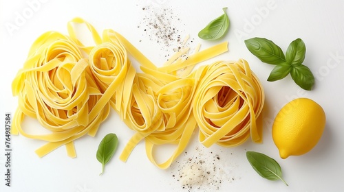 Fettuccine and spaghetti with ingredients for cooking pasta on a white background