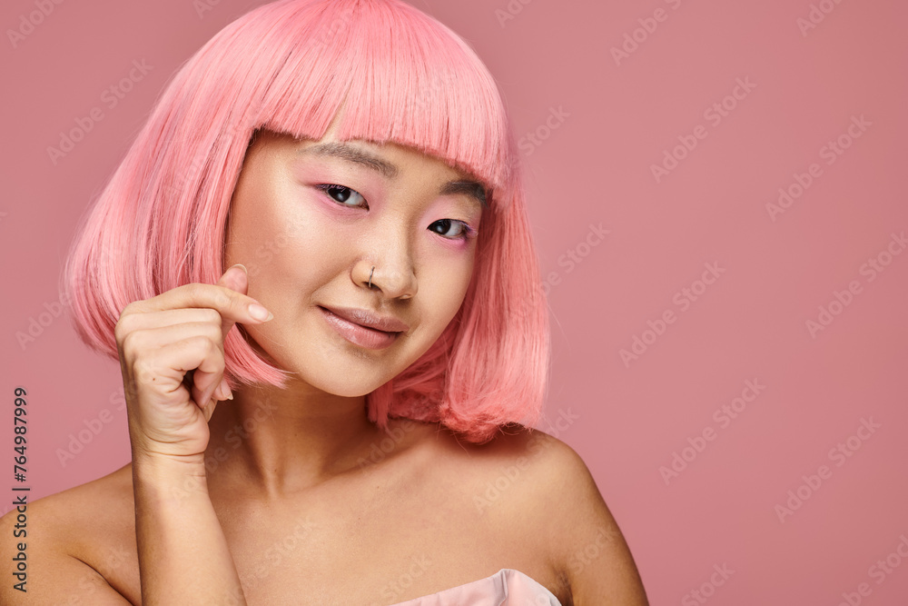 charming asian young woman with nose piercing showing heart sign and smiling in vibrant background charming asian young woman with nose piercing showing heart sign and smiling in vibrant background